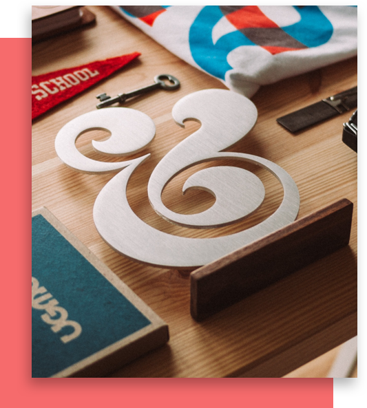 Elaborate Ampersand Symbol on Crowded Desk