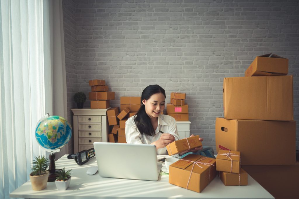 Woman business owner in small retail office.