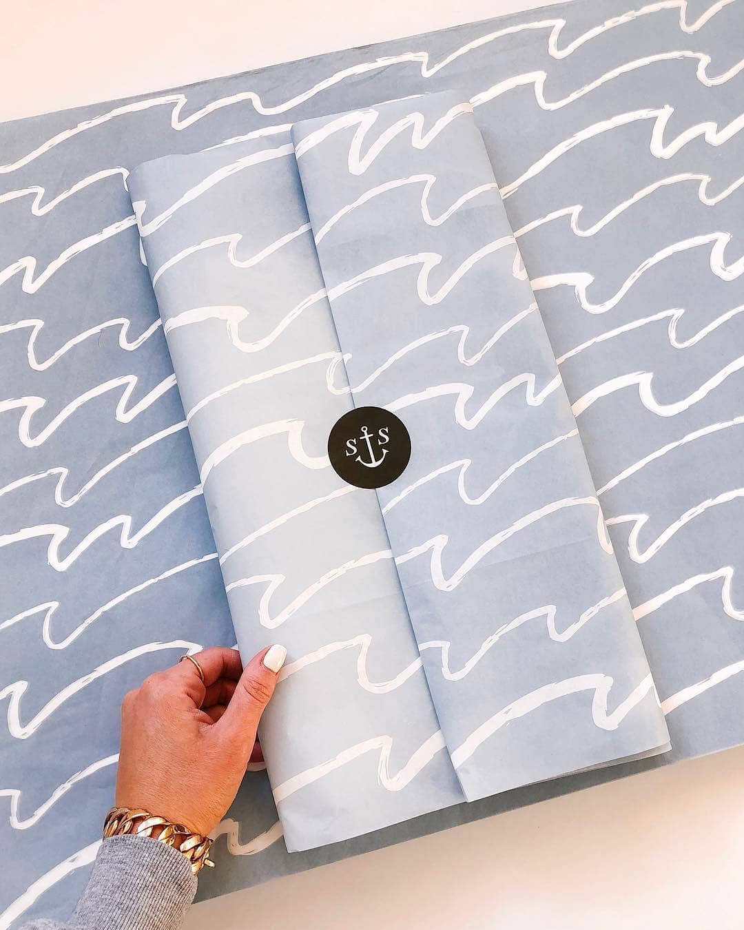 Nautical blue tissue packaging with wave design