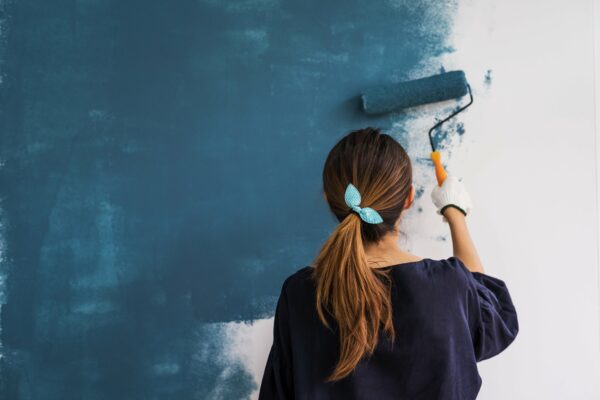 woman painting a wall