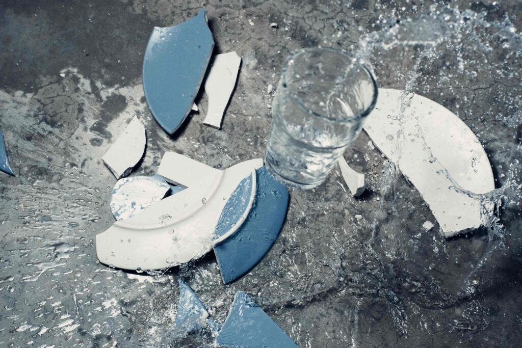 shattered plate and water spill