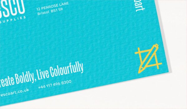 A business card paper example showing a linen texture, with teal, and yellow branding