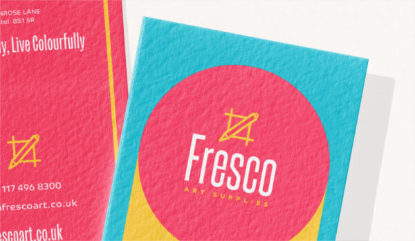 A cotton business card example with teal blue and coral pink branding